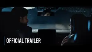 A dramatic short film trailer image with a man and woman sitting in a car, which says "Official Trailer"